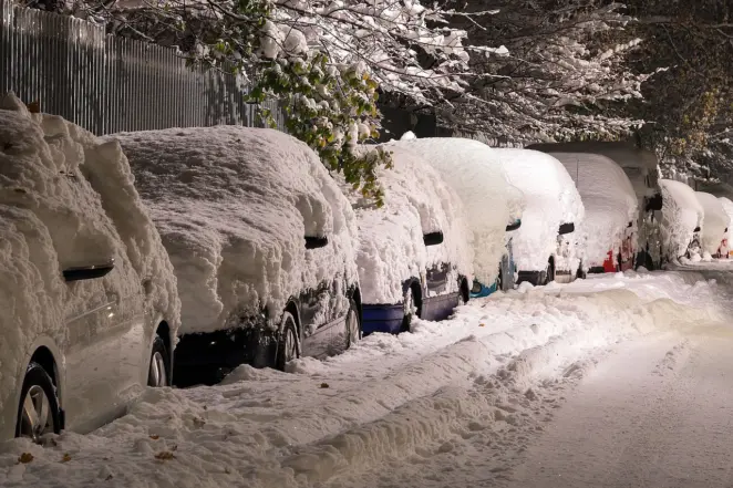 Cars covered by snow